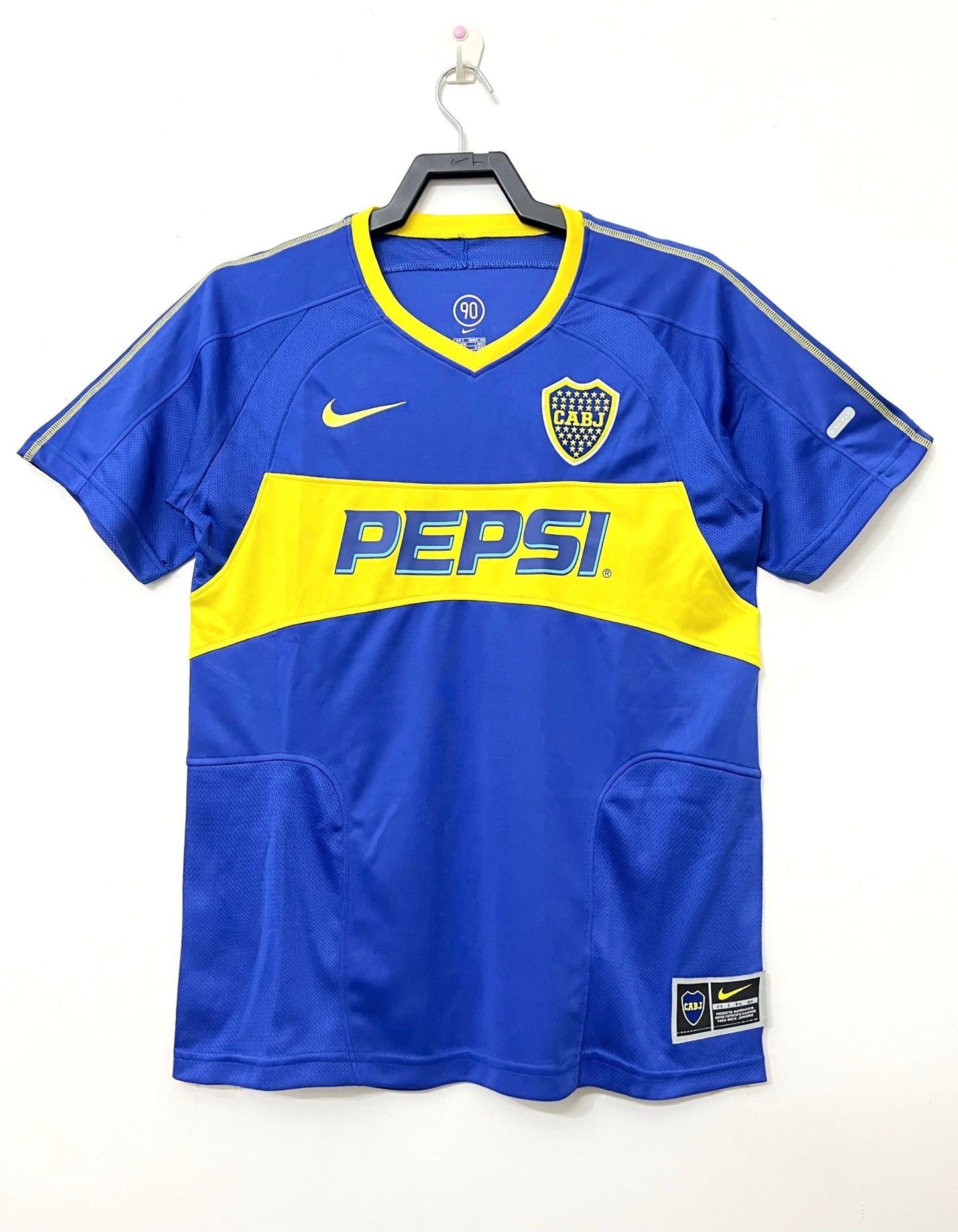 Alt Text: Boca Juniors 2003/04 home retro football jersey in blue and gold.