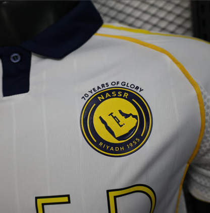 Close-up of Al Nassr logo on Riyadh Third Kit 25/26 jersey celebrating 70 years of glory.