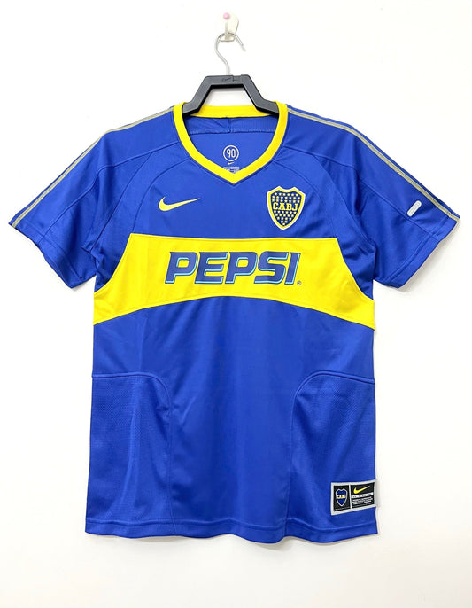 Alt Text: Boca Juniors 2003/04 home retro football jersey in blue and gold.